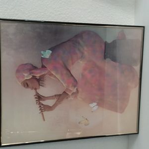 Black Art woman playing flute